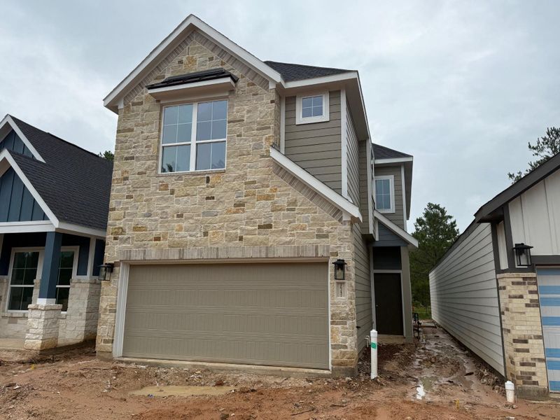 Front exterior of a new home in Kresston, Montgomery, TX, highlighting curb appeal (Image 7). Front exterior of a new home in Kresston, Montgomery, TX, highlighting curb appeal (Image 7).