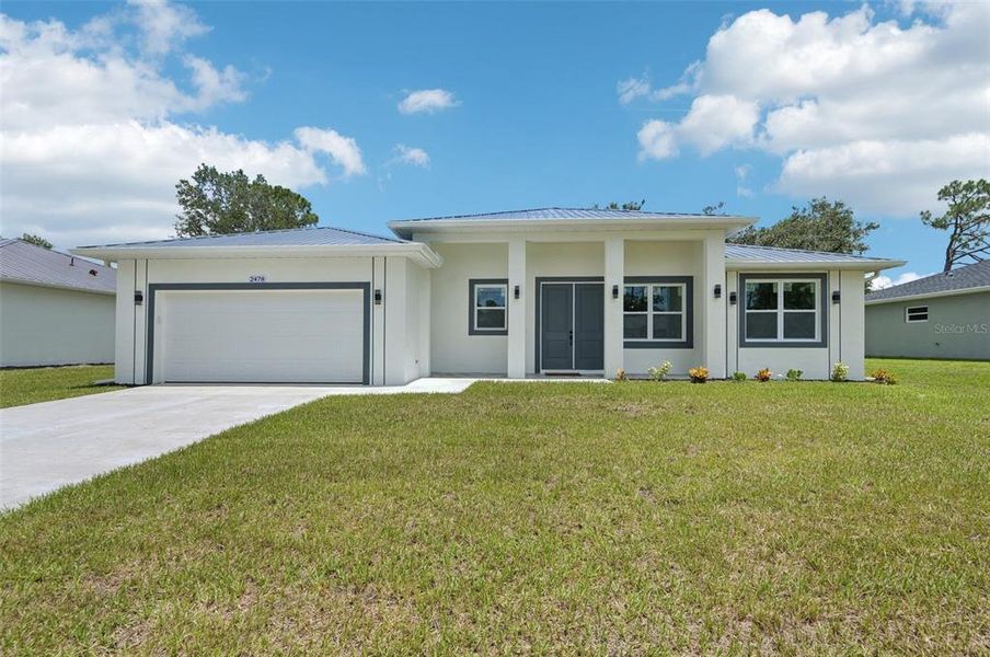Front exterior of a new home in , North Port, FL, highlighting curb appeal (Image 22).