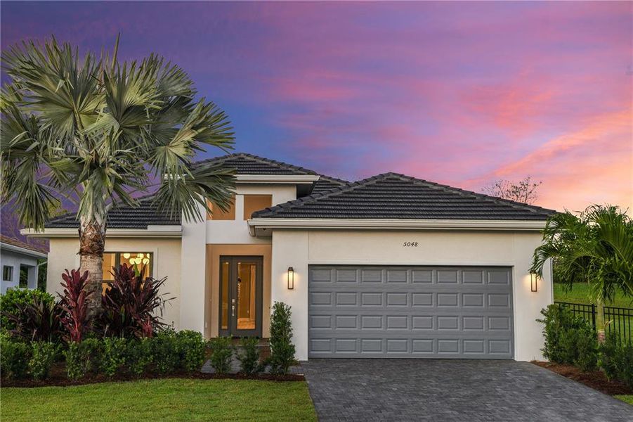 Front exterior of a new home in Cresswind Lakewood Ranch, Lakewood Ranch, FL, highlighting curb appeal (Image 1). Front exterior of a new home in Cresswind Lakewood Ranch, Lakewood Ranch, FL, highlighting curb appeal (Image 1).