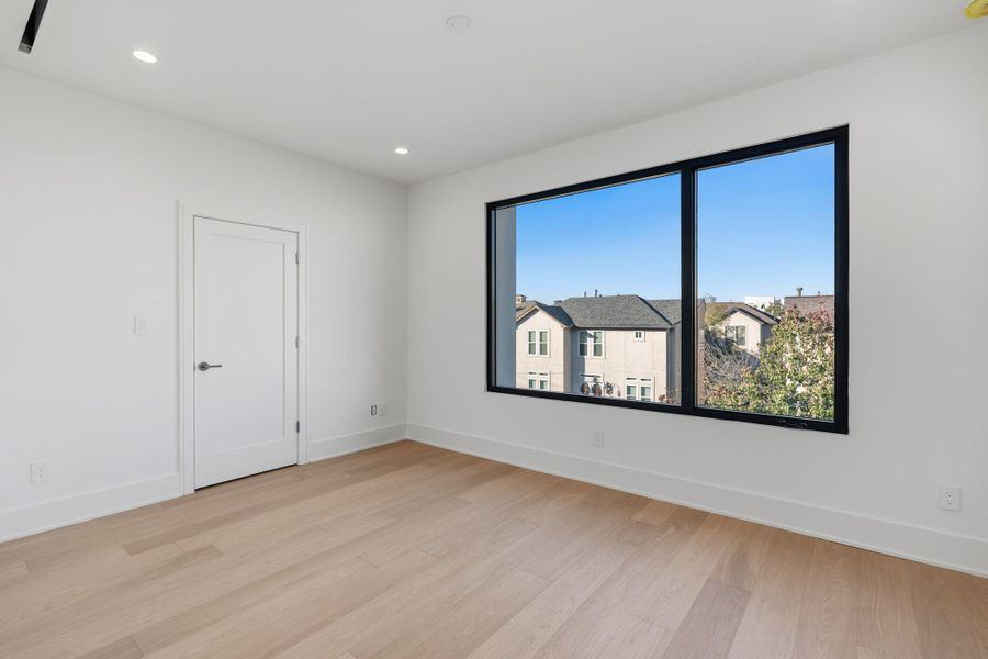 Beautiful guest bedroom with walk-in closet and ensuite bath.
