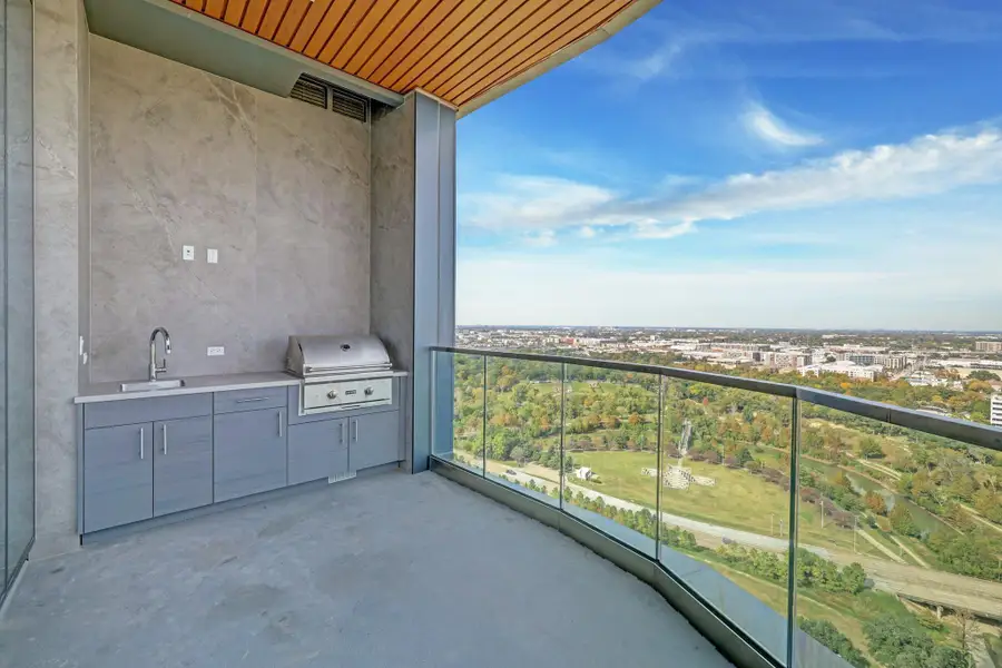 Year around outdoor dining on the private balcony and summer kitchen Year around outdoor dining on the private balcony and summer kitchen