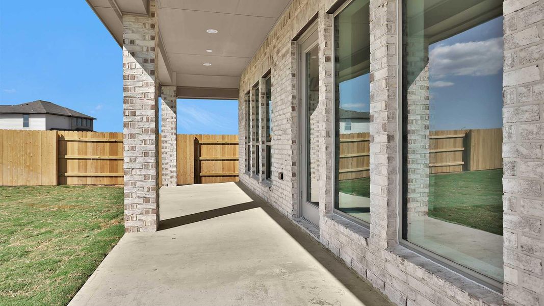 Exterior details and patio area of a home in Elyson 45', Katy (Image 4).
