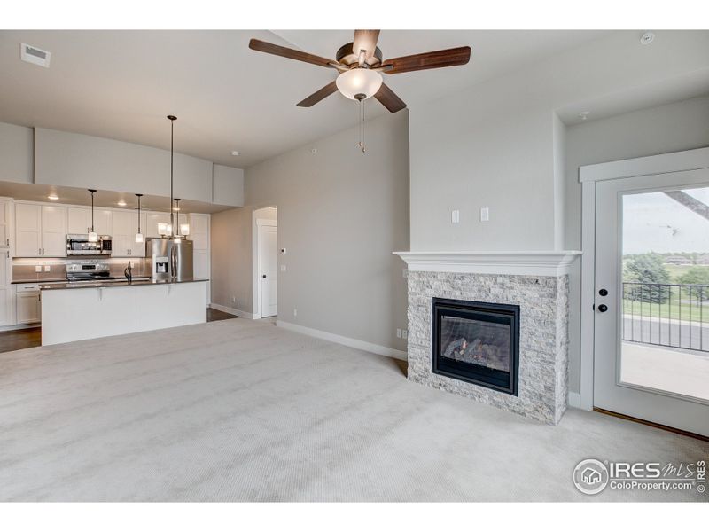 Living Room with Gas Fireplace-  Photos not of the actual unit. Finishes vary.