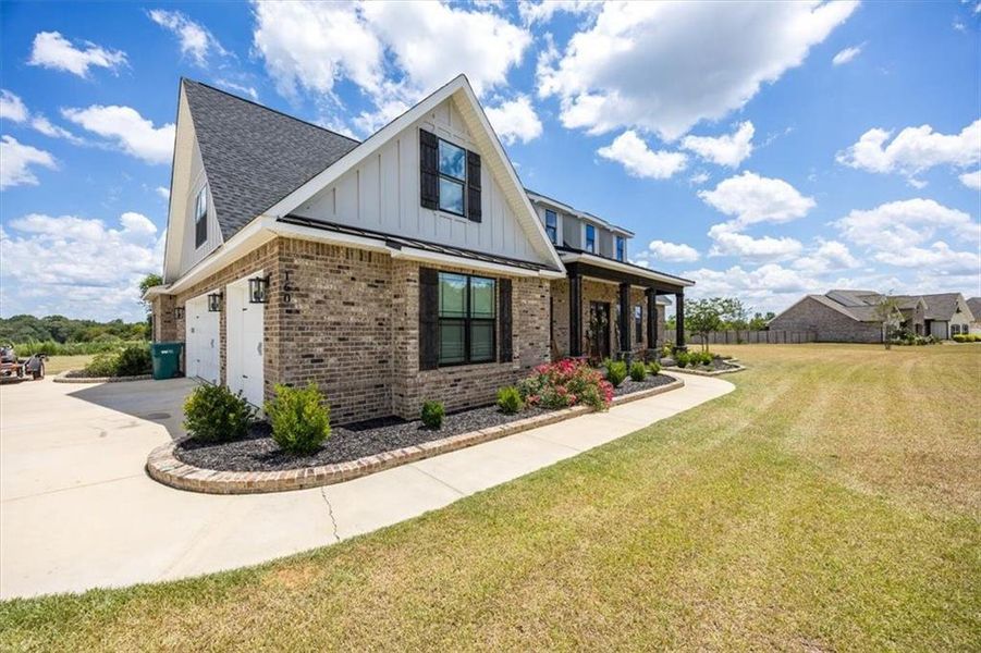 Front exterior of a new home in , Kathleen, GA, highlighting curb appeal (Image 23).