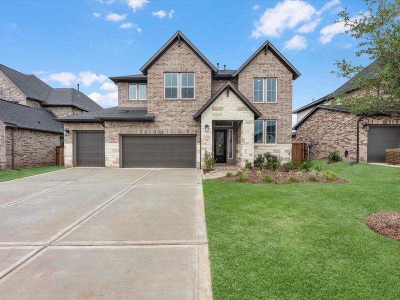 Front exterior of a new home in Clopton Farms, Montgomery, TX, highlighting curb appeal (Image 2). Front exterior of a new home in Clopton Farms, Montgomery, TX, highlighting curb appeal (Image 2).
