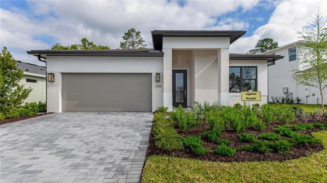 Front exterior of a new home in Cresswind DeLand, Deland, FL, highlighting curb appeal (Image 20). Front exterior of a new home in Cresswind DeLand, Deland, FL, highlighting curb appeal (Image 20).