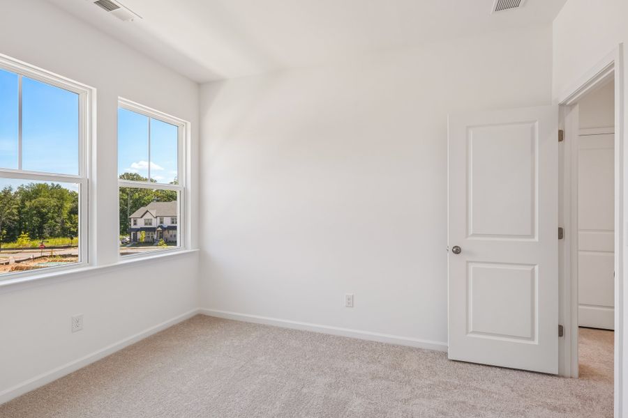 Spacious, unfurnished interior of a new home in Terraces at the Exchange, Indian Land (Image 28).