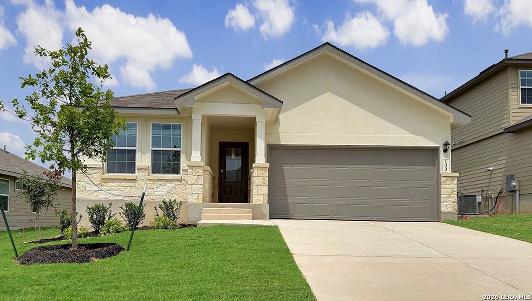 Front exterior of a new home in Redbird Ranch, San Antonio, TX, highlighting curb appeal (Image 2). Front exterior of a new home in Redbird Ranch, San Antonio, TX, highlighting curb appeal (Image 2).