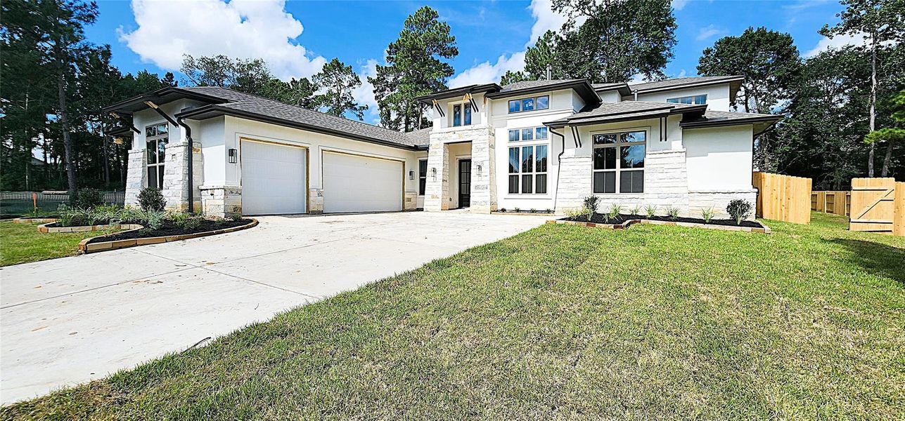 Front exterior of a new home in Stewart’s Forest, Conroe, TX, highlighting curb appeal (Image 18). Front exterior of a new home in Stewart’s Forest, Conroe, TX, highlighting curb appeal (Image 18).