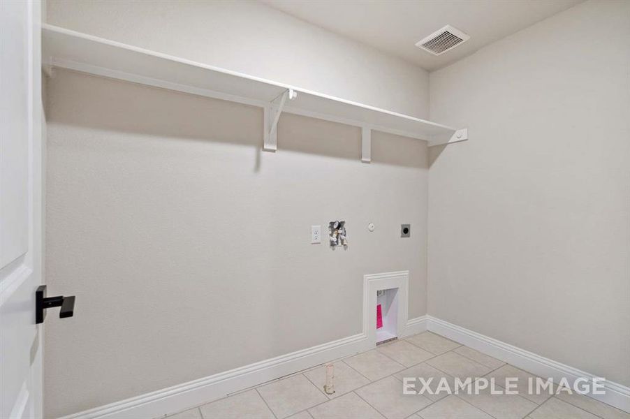 Laundry area featuring washer hookup, light tile patterned floors, hookup for a gas dryer, and electric dryer hookup