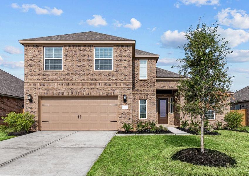 Beautiful two story home with brick and front yard landscaping