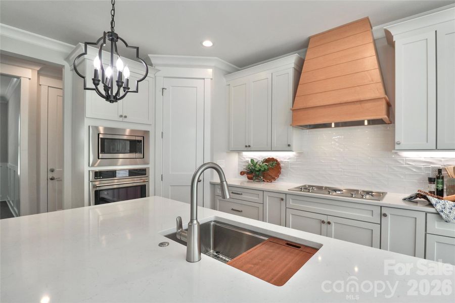 Featuring stainless steel appliances with custom cabinetry. Featuring stainless steel appliances with custom cabinetry.