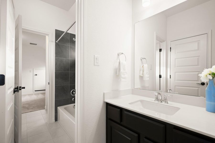 The other bedroom's private vanity area connects to the shared wet room with the shower/tub combo and toilet. The other bedroom's private vanity area connects to the shared wet room with the shower/tub combo and toilet.