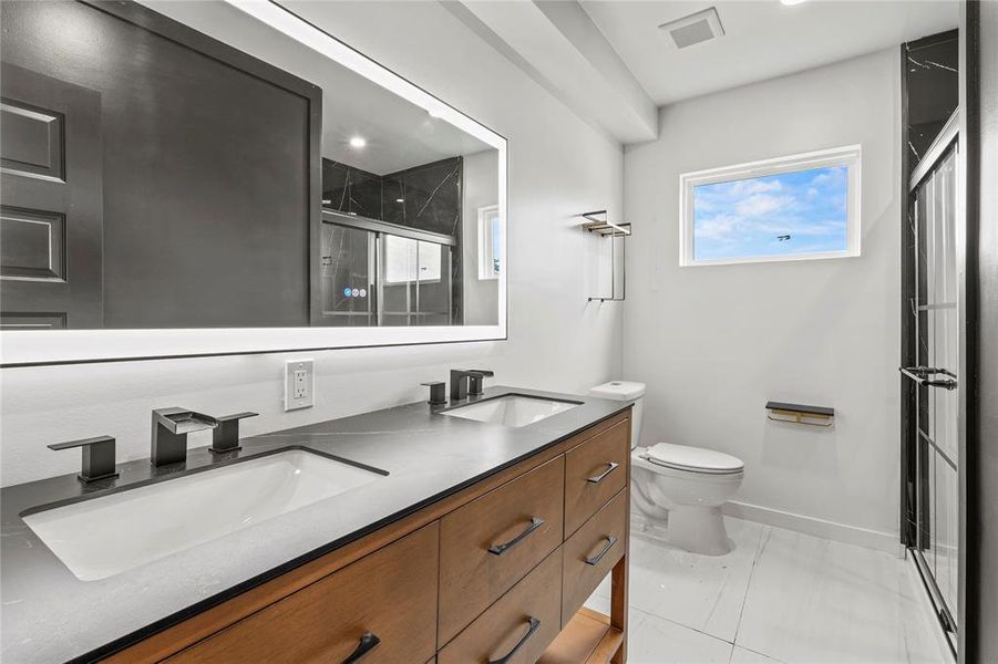 Full bath with double vanity and a stall shower Full bath with double vanity and a stall shower