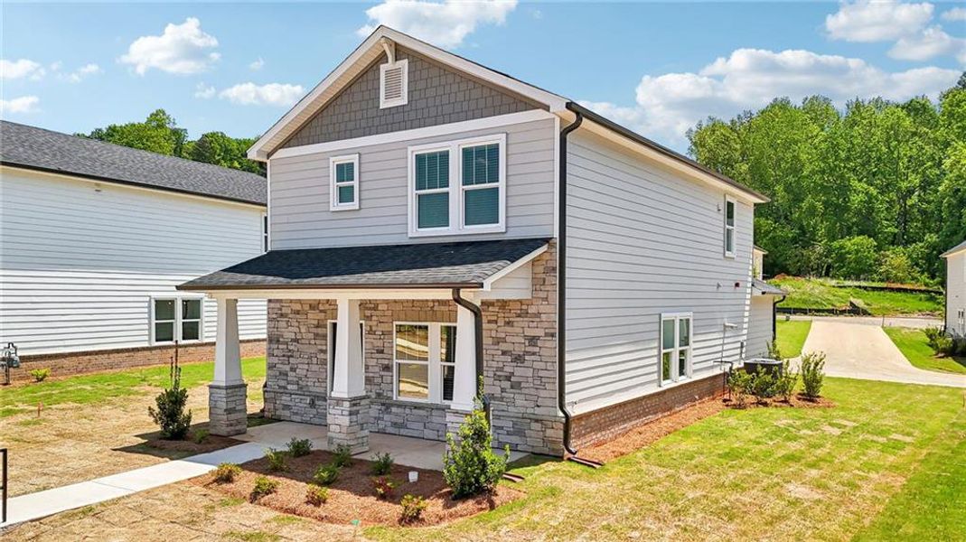 Front exterior of a new home in Hemingway - Cottage Series, Cumming, GA, highlighting curb appeal (Image 25). Front exterior of a new home in Hemingway - Cottage Series, Cumming, GA, highlighting curb appeal (Image 25).
