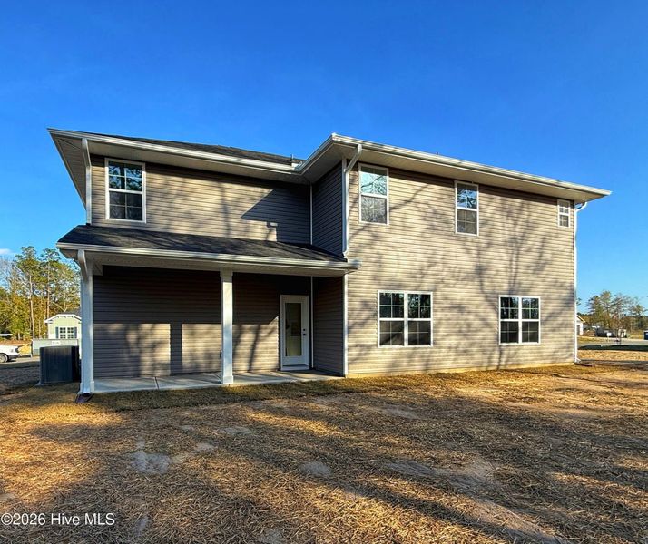 Exterior details and patio area of a home in Wood Creek Landing, Leland (Image 4).