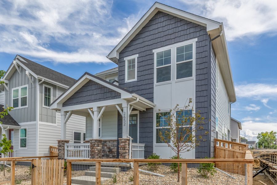 Front exterior of a new home in Arras Park, Thornton, CO, highlighting curb appeal (Image 24).