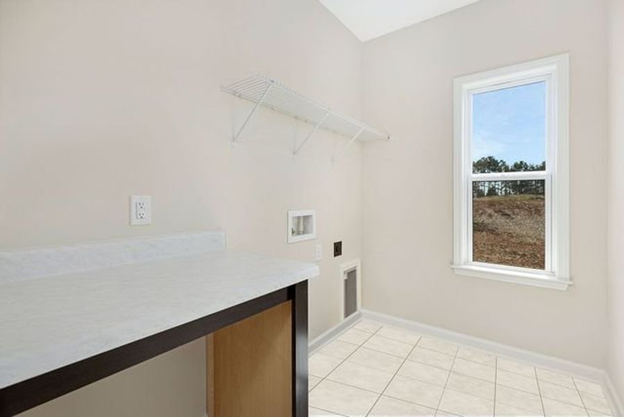 Representative unfurnished interior of a home built from the Broadway by True Homes in Fairview Forest, Lake Park (Image 20).