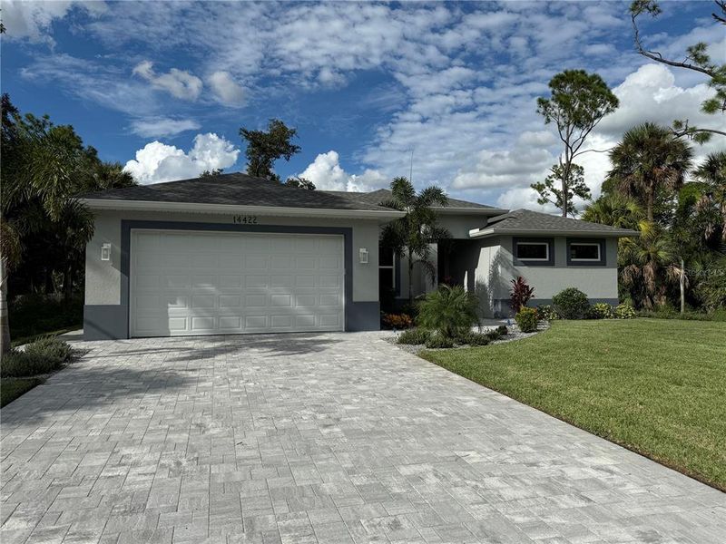 Front exterior of a new home in , Port Charlotte, FL, highlighting curb appeal (Image 2).