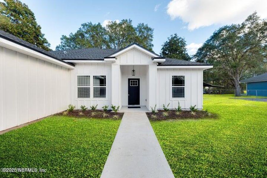 Front exterior of a new home in , Middleburg, FL, highlighting curb appeal (Image 2). Front exterior of a new home in , Middleburg, FL, highlighting curb appeal (Image 2).