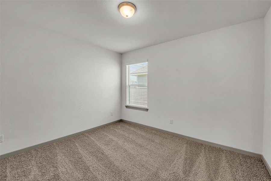 Spare room with carpet flooring and baseboards