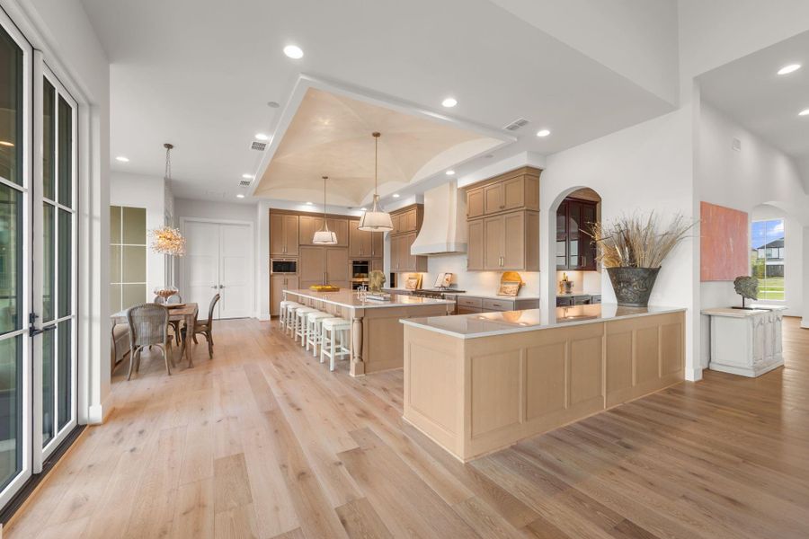 Large island kitchen with Wolfe and Sub Zero appliances including double ovens, two dishwashers, and a gas cooktop with grill. Large island kitchen with Wolfe and Sub Zero appliances including double ovens, two dishwashers, and a gas cooktop with grill.