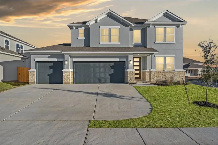 Front exterior of a new home in Enclave at Cele, Pflugerville, TX, highlighting curb appeal (Image 1).