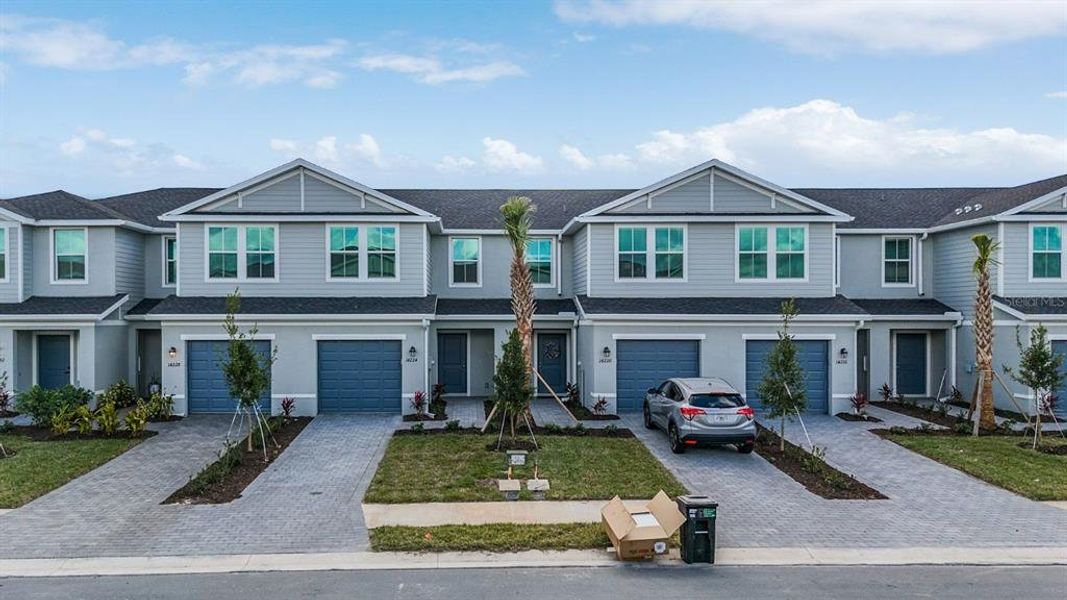 Front exterior of a new home in , Bradenton, FL, highlighting curb appeal (Image 1).