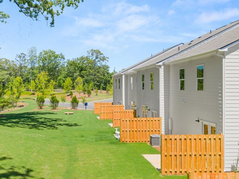 Exterior details and patio area of a home in Falcon Landing Townhomes, Gainesville (Image 3).