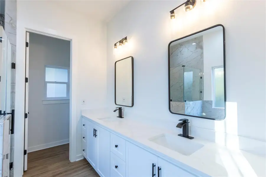 Double vanity with ample counter space.