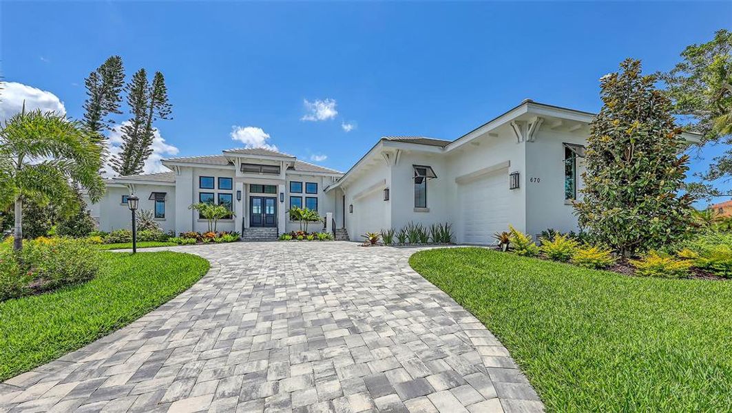 Front exterior of a new home in , Longboat Key, FL, highlighting curb appeal (Image 28).