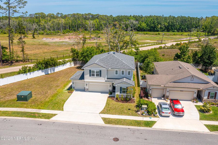 Front exterior of a new home in Woodbridge, Fernandina Beach, FL, highlighting curb appeal (Image 26).