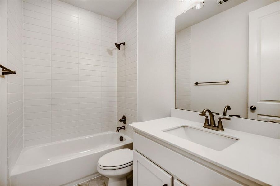 Bathroom featuring bathing tub / shower combination and vanity