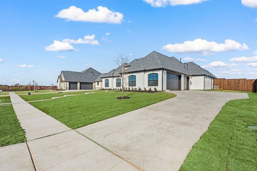 Front exterior of a new home in , Haslet, TX, highlighting curb appeal (Image 2). Front exterior of a new home in , Haslet, TX, highlighting curb appeal (Image 2).