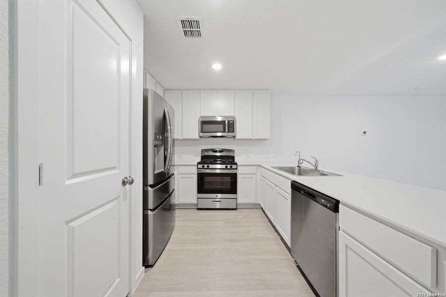 Furnished interior view inside a new home in Morgan Heights, San Antonio (Image 12).