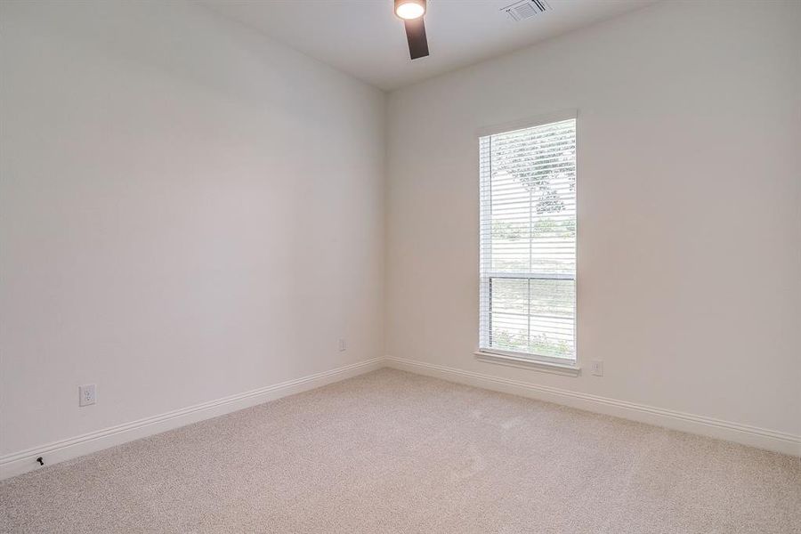 Secondary bedroom with ceiling fan. Secondary bedroom with ceiling fan.