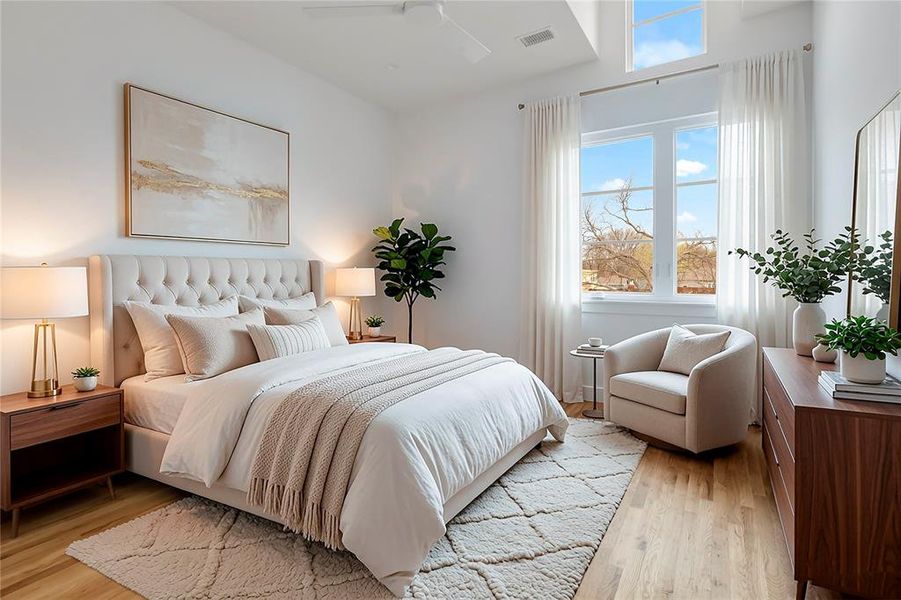 VIRTUALLY STAGED: Spacious room featuring hardwood flooring, a large window with transom, a ceiling fan, and white walls