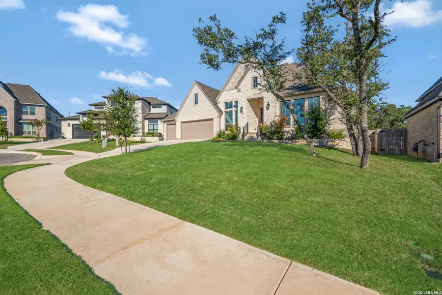 Front exterior of a new home in The Ranches at Creekside, Boerne, TX, highlighting curb appeal (Image 1). Front exterior of a new home in The Ranches at Creekside, Boerne, TX, highlighting curb appeal (Image 1).