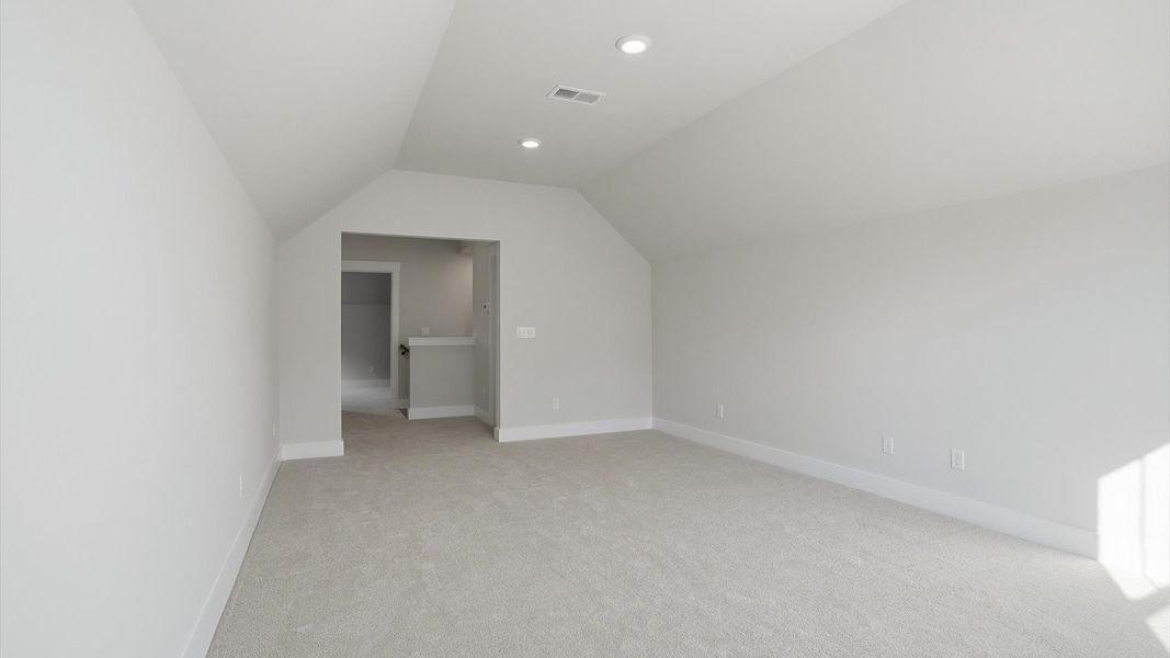 Inviting bonus space with cozy carpet, perfect for casual gatherings or quiet relaxation located in Greenville, SC