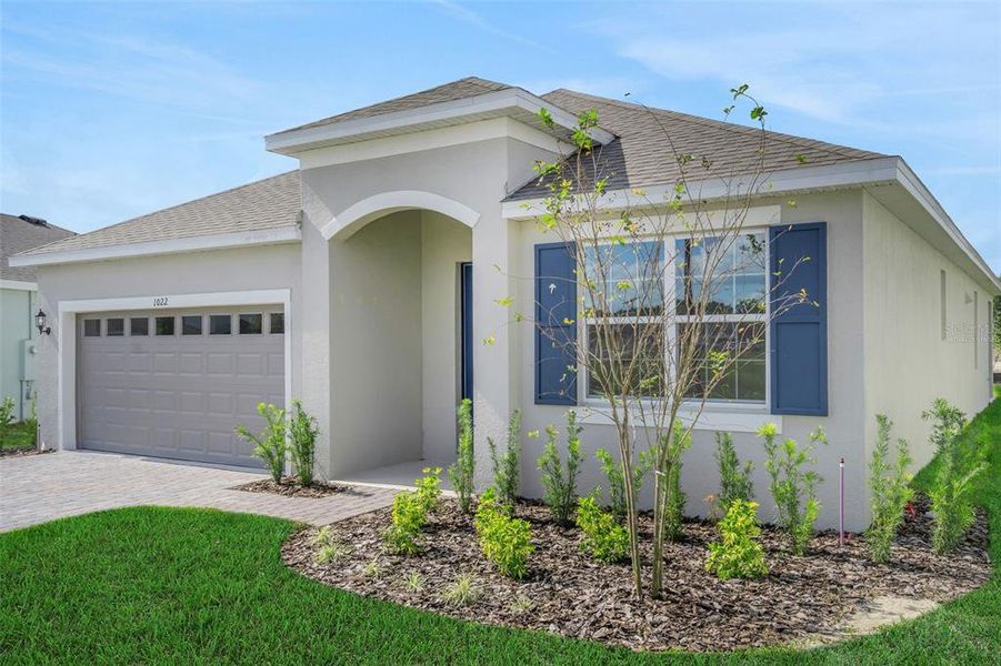 Front exterior of a new home in Reserve at Hammock Oaks, Lady Lake, FL, highlighting curb appeal (Image 2). Front exterior of a new home in Reserve at Hammock Oaks, Lady Lake, FL, highlighting curb appeal (Image 2).