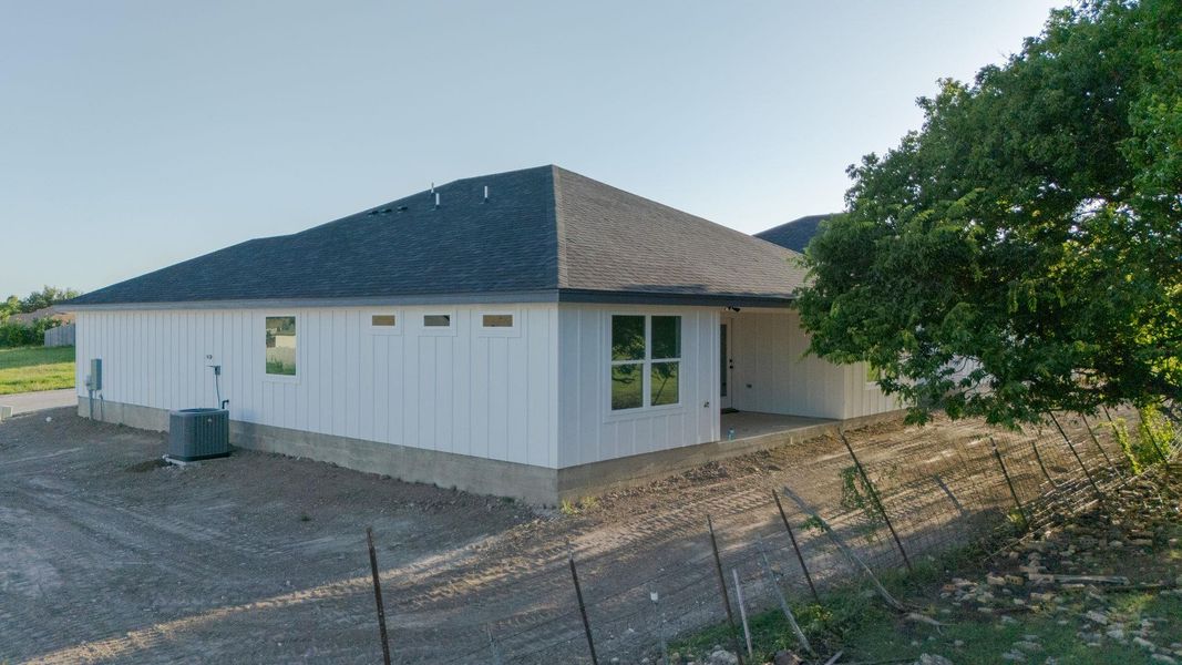 View of side of property with roof with shingles View of side of property with roof with shingles