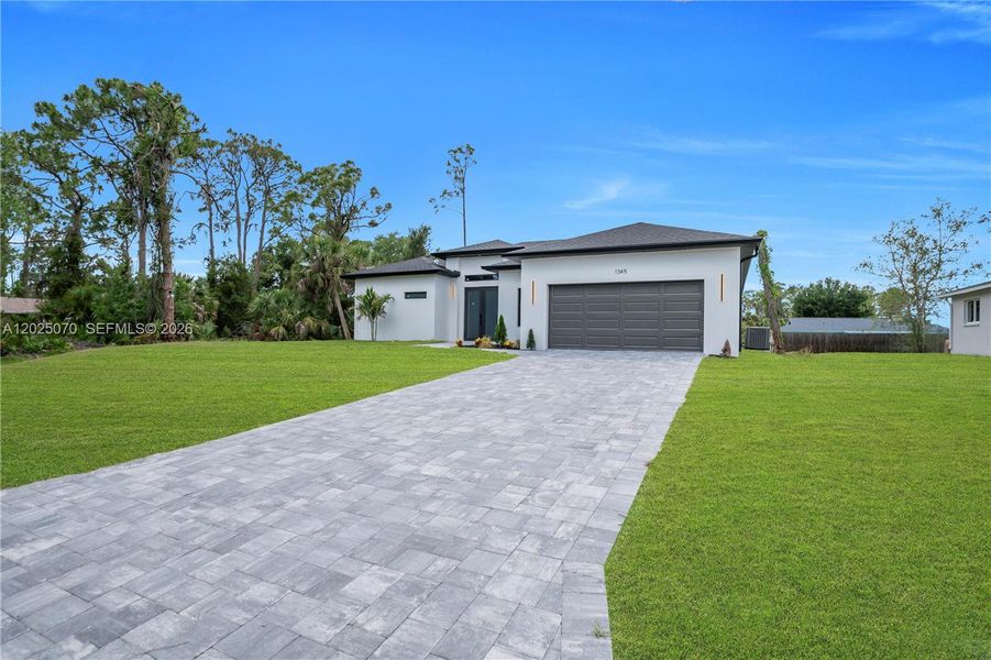 Front exterior of a new home in , North Port, FL, highlighting curb appeal (Image 20).