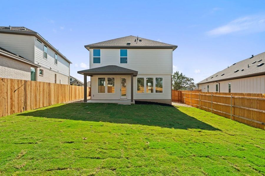 Exterior details and patio area of a home in Terrace Collection at Heritage, Dripping Springs (Image 18).