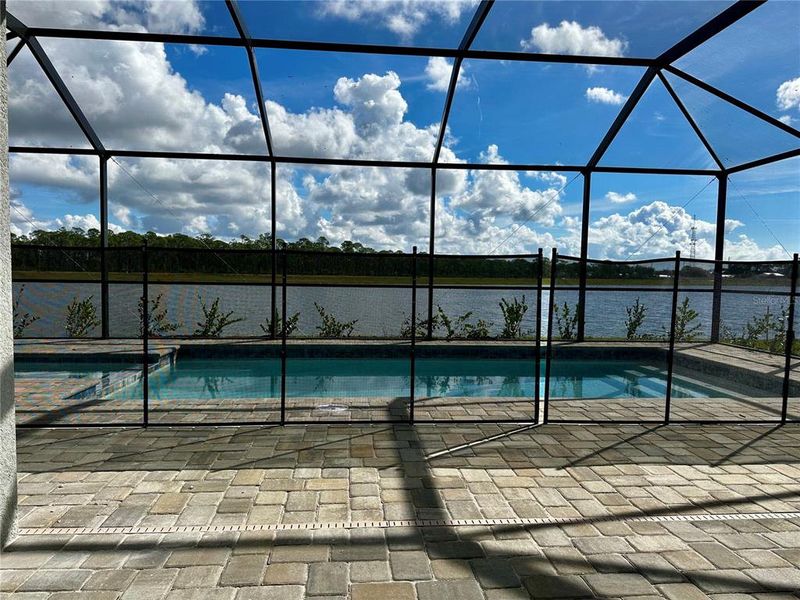 Exterior details and patio area of a home in Island Lakes at Coco Bay: Executive Homes, Englewood (Image 3).