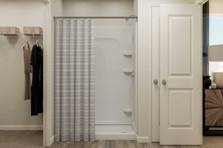 A shower with a glass door. A shower with a glass door.