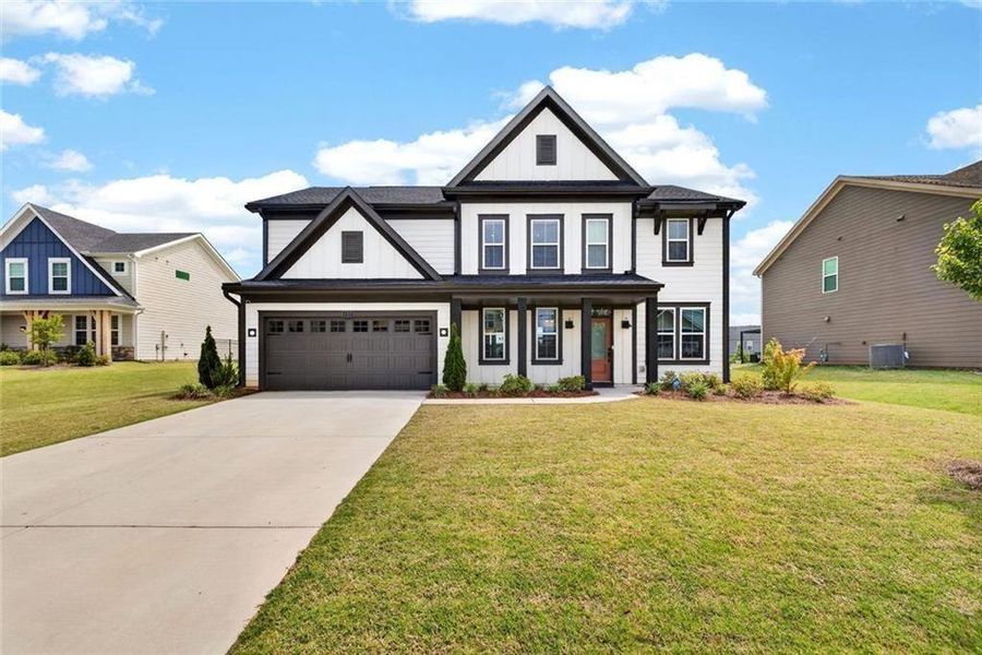 Front exterior of a new home in Sweetbay Farm, Lawrenceville, GA, highlighting curb appeal (Image 2). Front exterior of a new home in Sweetbay Farm, Lawrenceville, GA, highlighting curb appeal (Image 2).