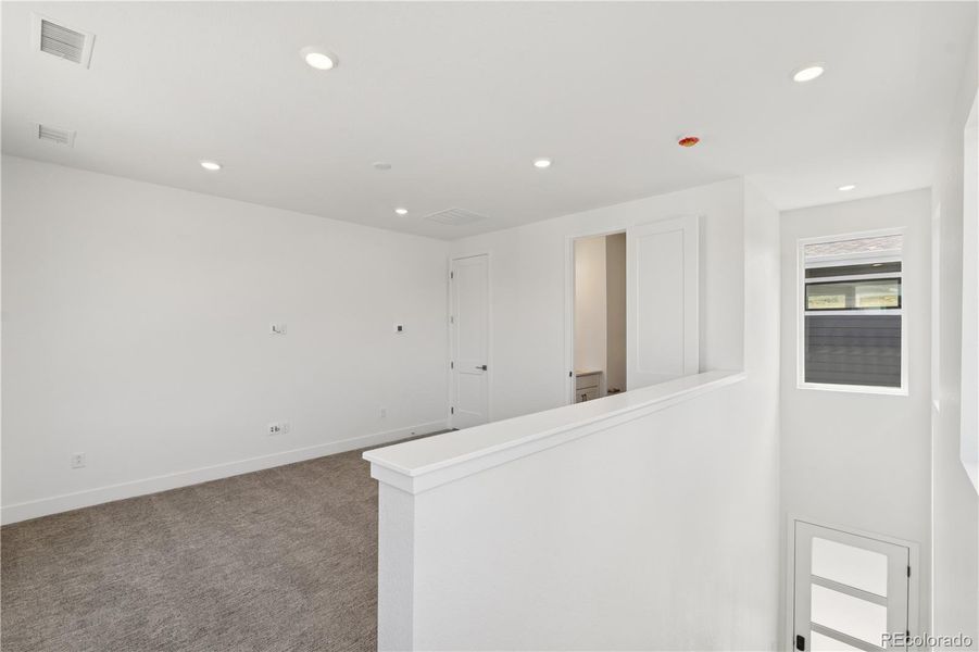 Spacious, unfurnished interior of a new home in Storytellers at Lyric, Lone Tree (Image 23).