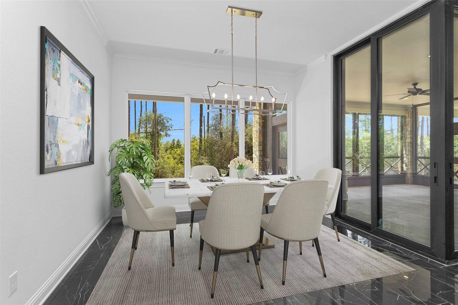 The dining area exudes elegance with forest-facing windows, a contemporary chandelier, and seamless access to the screened patio for effortless indoor-outdoor entertaining.