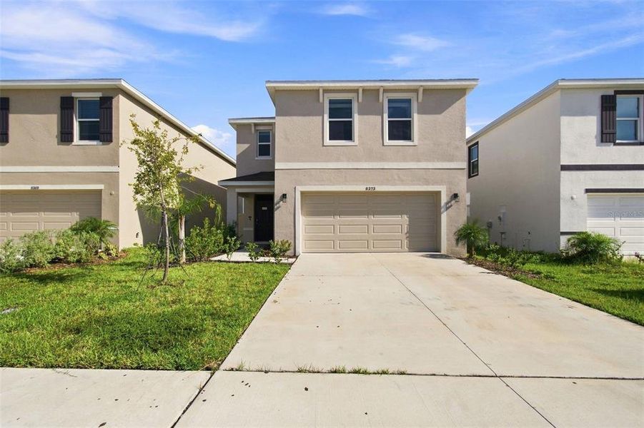 Front exterior of a new home in , Wesley Chapel, FL, highlighting curb appeal (Image 24).