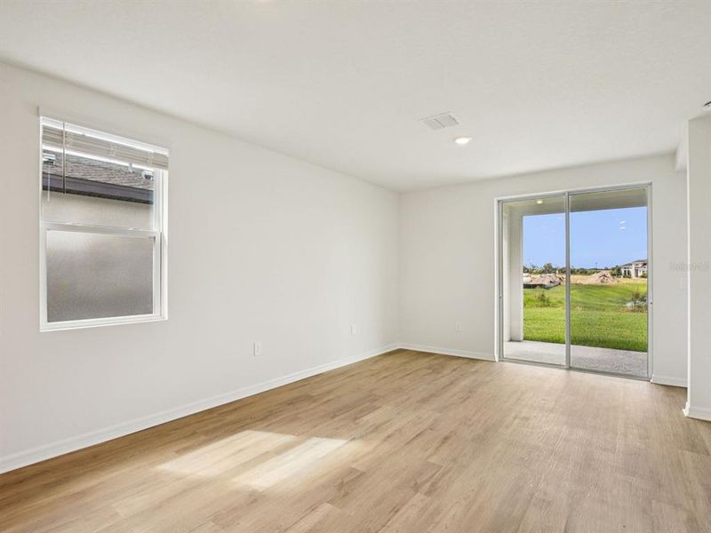 Spacious, unfurnished interior of a new home in The Grove at Stuart Crossing - Premier Series, Bartow (Image 18).